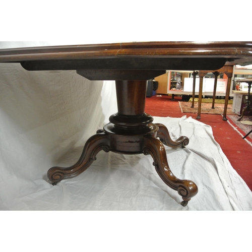 155 - Victorian mahogany library or breakfast table with rounded borders, tip-up top, on turned tapering c... 