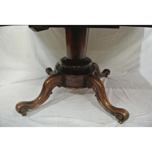 155 - Victorian mahogany library or breakfast table with rounded borders, tip-up top, on turned tapering c... 