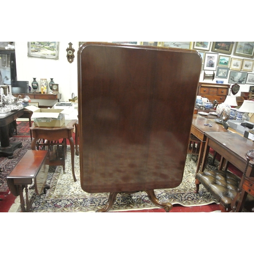 155 - Victorian mahogany library or breakfast table with rounded borders, tip-up top, on turned tapering c... 