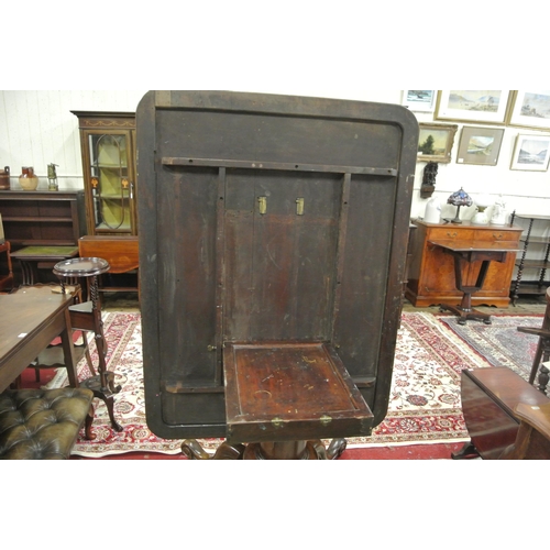 155 - Victorian mahogany library or breakfast table with rounded borders, tip-up top, on turned tapering c... 