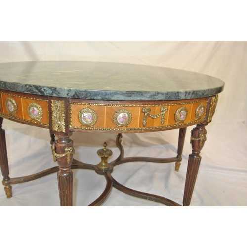 165 - French round marble topped table with ornate ormolu mounts and enamed figured panels, reeded legs an... 