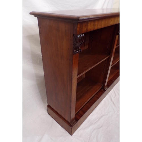 175 - Edwardian mahogany open bookcase with scroll decoration,  adjustable shelving, on oblong plinth