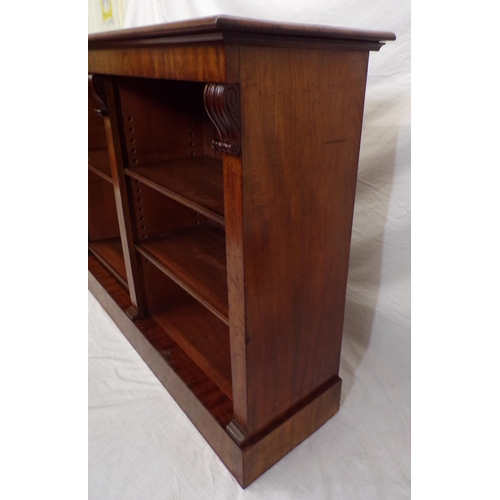 175 - Edwardian mahogany open bookcase with scroll decoration,  adjustable shelving, on oblong plinth