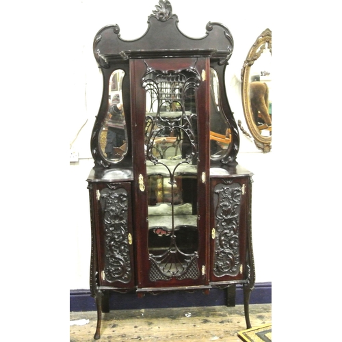 185 - Victorian mahogany display cabinet with ornate scroll decorated back, shaped bevelled mirror insets,... 