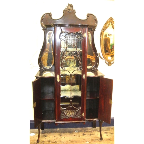 185 - Victorian mahogany display cabinet with ornate scroll decorated back, shaped bevelled mirror insets,... 