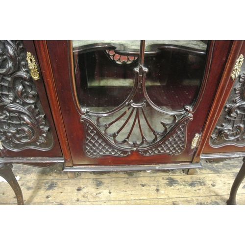 185 - Victorian mahogany display cabinet with ornate scroll decorated back, shaped bevelled mirror insets,... 