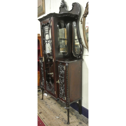 185 - Victorian mahogany display cabinet with ornate scroll decorated back, shaped bevelled mirror insets,... 