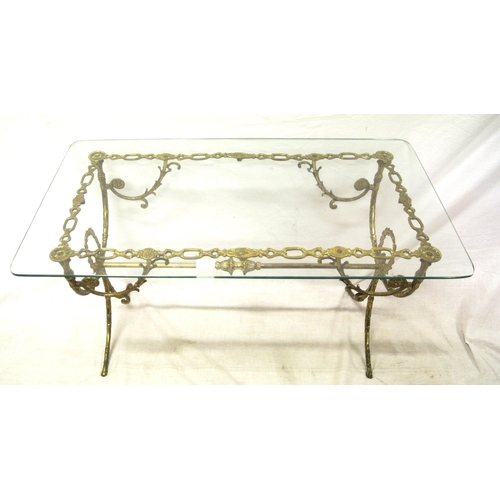 209 - Ornate glass topped brass coffee table with shaped legs