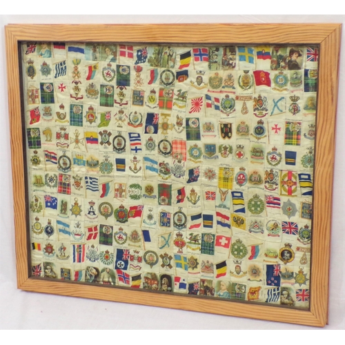 253 - Framed collection of WW1 and WW2 cigarettes silks and flags etc, 55x65cm