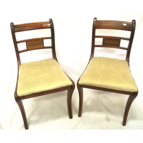 299 - Pair of Edwardian occasional chairs with railed backs, upholstered seats, on sabre legs