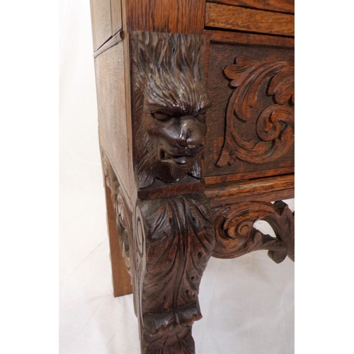 30 - Victorian oak cabinet with ornate bird decorated carved doors, frieze drawer, on carved legs