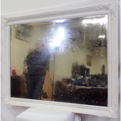 32 - Large bevelled glass wall mirror with foliate decorated frame