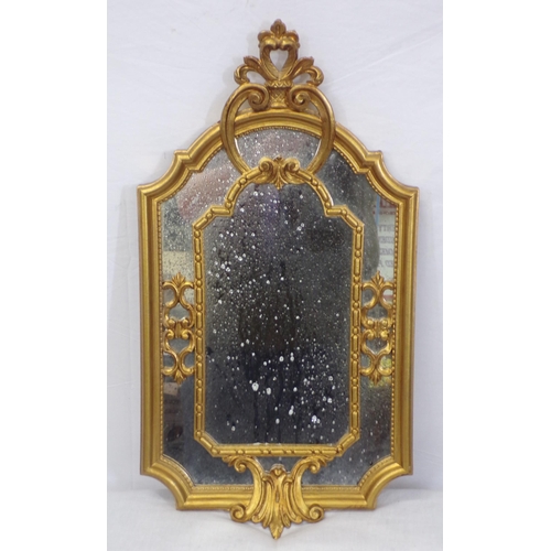 38 - Ornate Regency design small gilt framed dome top wall mirror with scroll decoration