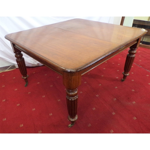 40 - Victorian mahogany dining table on raised on turned reeded legs with castors (with one extra spare l... 