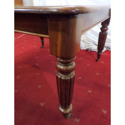 40 - Victorian mahogany dining table on raised on turned reeded legs with castors (with one extra spare l... 