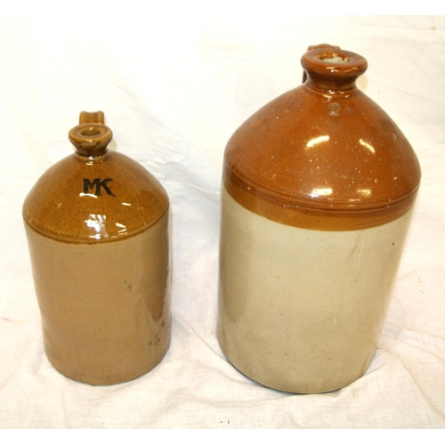 43 - Two round earthenware measures with shaped handles