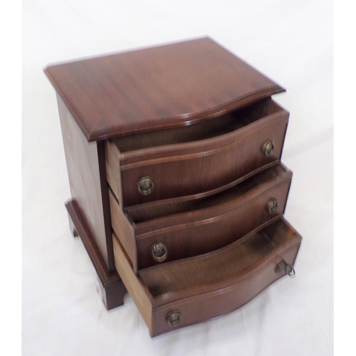 52 - Edwardian serpentine fronted mahogany chest of three drawers with drop handles, on bracket feet