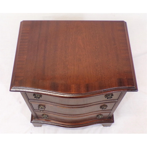 52 - Edwardian serpentine fronted mahogany chest of three drawers with drop handles, on bracket feet