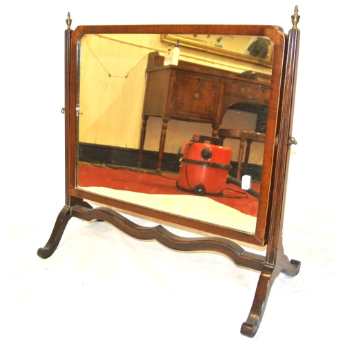 57 - Edwardian mahogany swivel mirror with reeded tapering columns and scroll legs