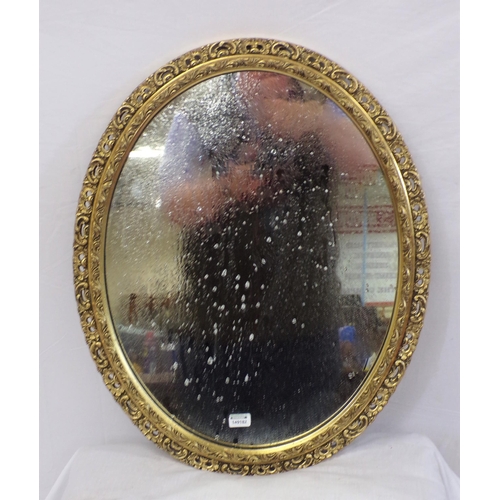 7 - Ornate oval wall mirror with scroll and foliate decoration