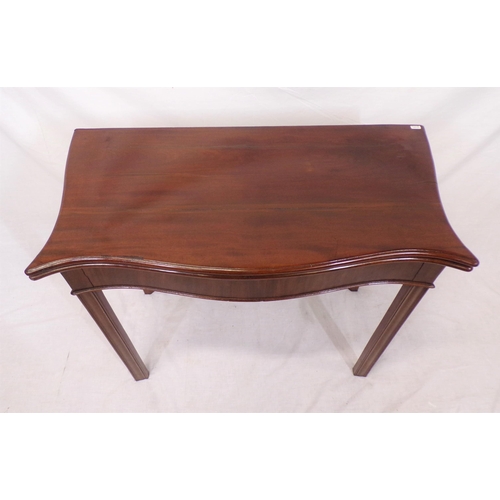 85 - Georgian mahogany card table with serpentine borders, fold-over top, gateleg support, on chamfered l... 