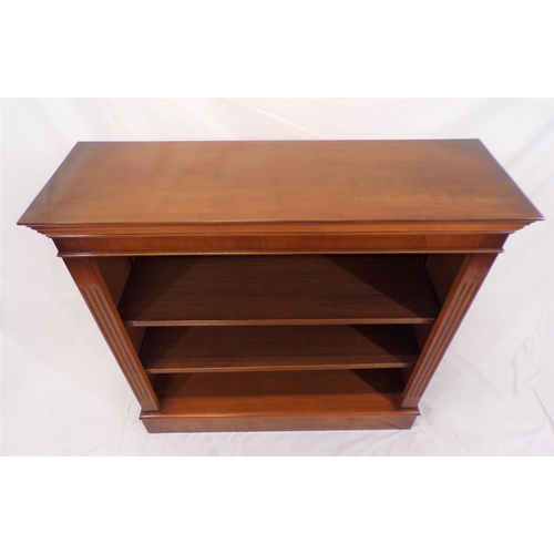 86 - Edwardian yew bookcase with reeded adjustable  shelving, on oblong base