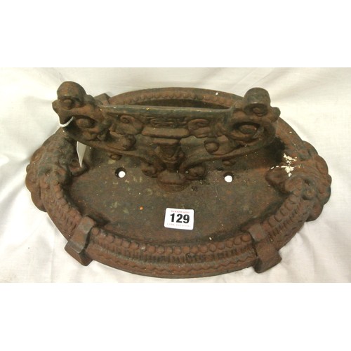 129 - Georgian style cast iron oval boot scraper with scroll decoration