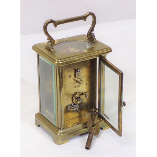 240 - Brass and enamel carriage clock with shaped handle