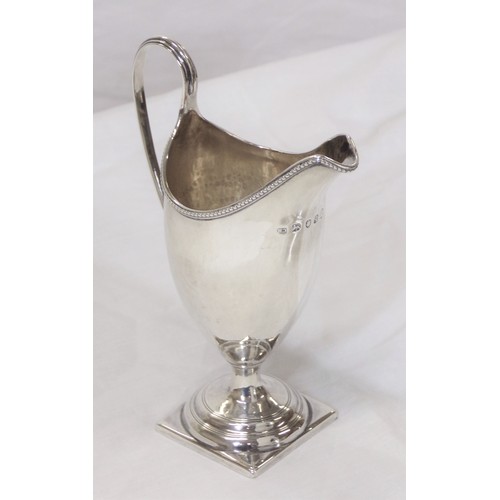 230 - George III London silver helmet shaped cream jug with beaded rim, shaped handle, on raised base 106g