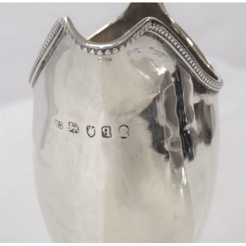 230 - George III London silver helmet shaped cream jug with beaded rim, shaped handle, on raised base 106g