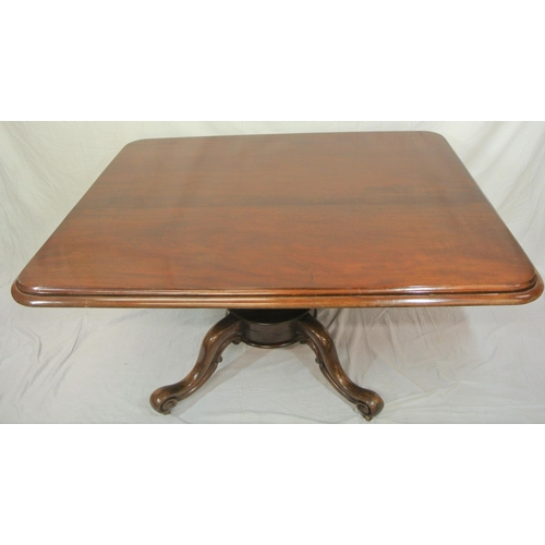 75 - Victorian mahogany library or breakfast table with rounded borders, tip-up top, on turned tapering c... 