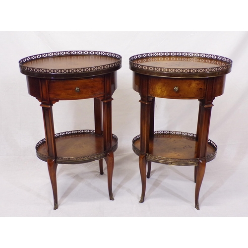 116 - Pair of Edwardian style oval two tier occasional tables with pierced gallery, bowed frieze drawer, s... 