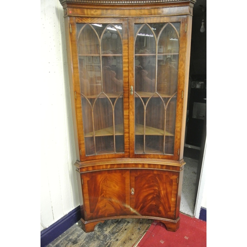 120 - Edwardian mahogany concave fronted corner display cabinet with dentil frieze, bowed doors with astra... 