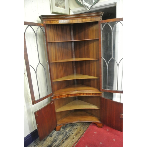 120 - Edwardian mahogany concave fronted corner display cabinet with dentil frieze, bowed doors with astra... 