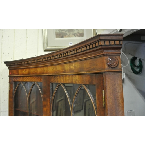 120 - Edwardian mahogany concave fronted corner display cabinet with dentil frieze, bowed doors with astra... 