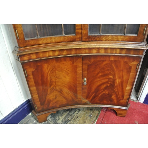 120 - Edwardian mahogany concave fronted corner display cabinet with dentil frieze, bowed doors with astra... 