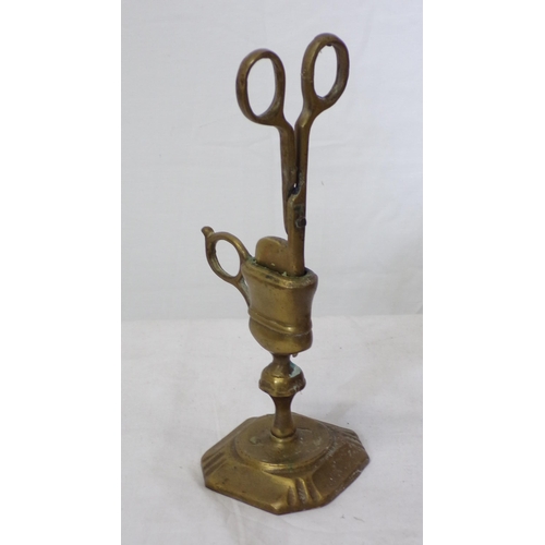 123 - Ornate brass candle snuffers on shaped base