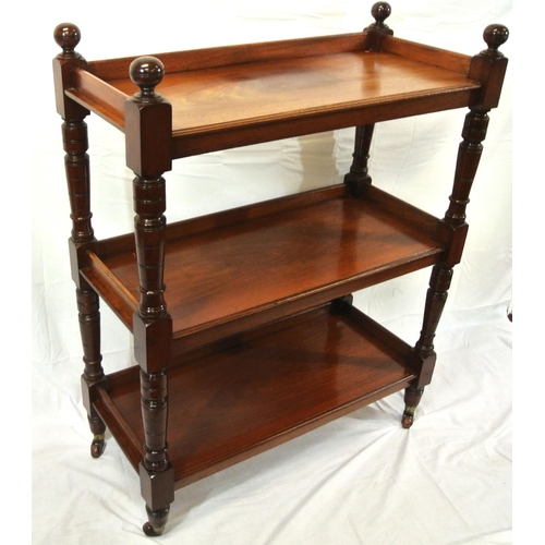 130 - Victorian mahogany three tier dumbwaiter with raised gallery, turned finials and rails, on castors