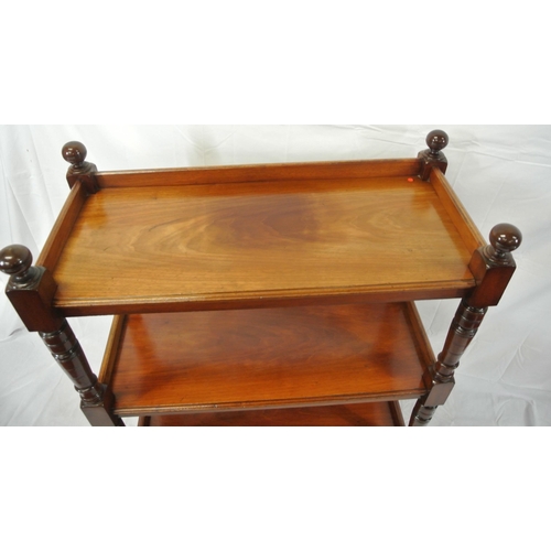 130 - Victorian mahogany three tier dumbwaiter with raised gallery, turned finials and rails, on castors