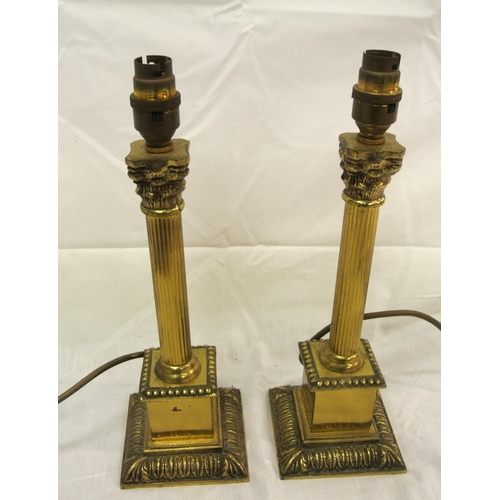 132 - Pair of brass electric table lamps with reeded Corinthian columns and stepped bases