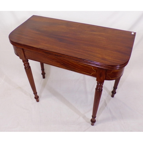 135 - Edwardian mahogany card table with fold-over top, reeded borders, gateleg support, on reeded taperin... 