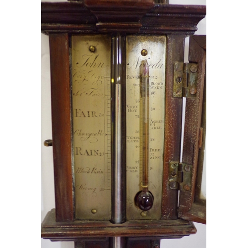 142 - Victorian mahogany stick barometer with shaped pediment and round base by John Noida