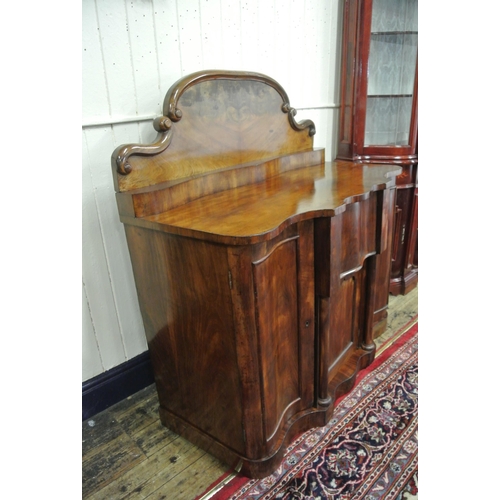 150 - Victorian mahogany chiffonier with shaped scroll decorated back, centre drawer and press, two side p... 