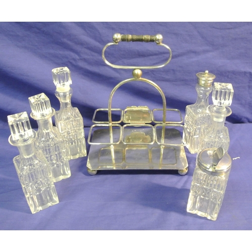 178 - Victorian style silverplated cruet set with six glass bottles and shaped handle