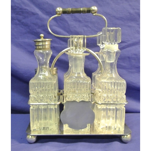 178 - Victorian style silverplated cruet set with six glass bottles and shaped handle