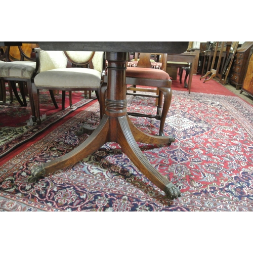 225 - Edwardian mahogany twin pedestal dining table with reeded borders, two extra leaves inset, raised on... 