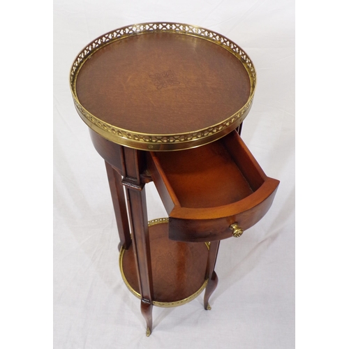 54 - Edwardian walnut two tier round jardiniere or plant stand with pierced brass gallery, frieze drawer,... 