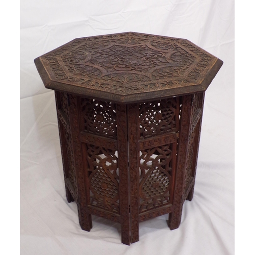 56 - Indian carved teak hexagonal shaped occasional table with folding base