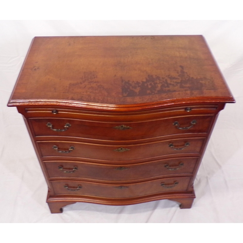 61 - Edwardian walnut and mahogany serpentine fronted bachelors chest with pull-out shelf, four drawers u... 