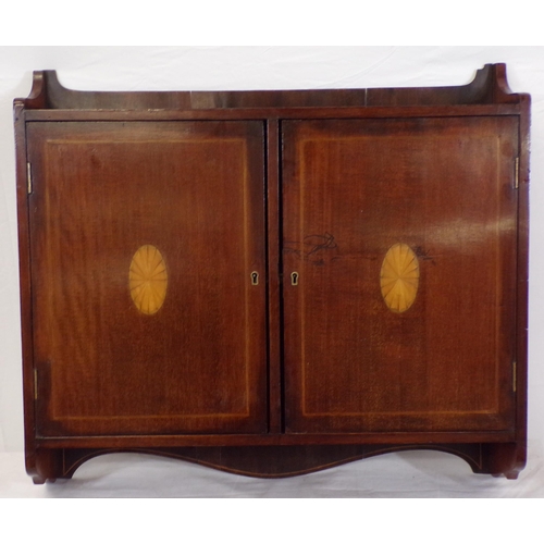 62 - Edwardian inlaid mahogany medicine cabinet or press with shelved interior, shell inlay, and shaped s... 